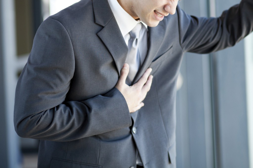 young businessman having chest pain